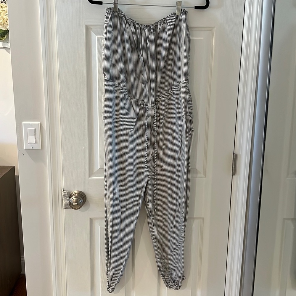 Medium strapless black and white striped jumpsuit.